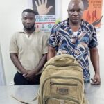 Fugitive Drug Kingpin, Ex-International Footballer Jailed 24 Years Over Cocaine Importation Ntoruka Emmanuel Chinedu (right) and former international footballer Hunkarin Segun George (left)
