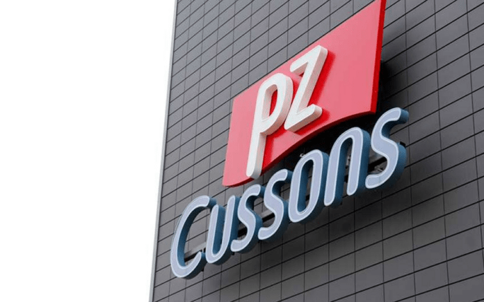PZ PZ Cussons logo on a dark tiled exterior wall of a building