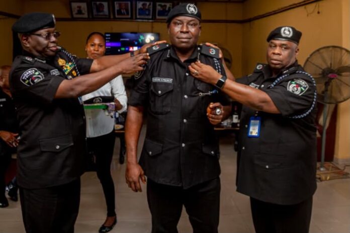 CP Baba Mohammad Azare, decorating a newly promoted Assistant Commissioner of Police in Akwa Ibom CP Baba Mohammad Azare, decorating a newly promoted Assistant Commissioner of Police in Akwa Ibom
