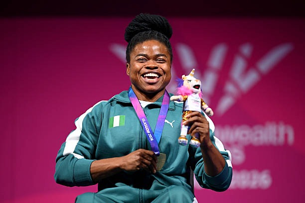 Gold medalist Esther Nworgu of Team Nigeria celebrates during the medal ceremony for Women's Para Powerlifting Lightweight Group A on day one of the Glasgow 2026 Commonwealth Games at SEC Armadillo on July 24, 2026, in Glasgow, Scotland. (Photo by Mattia Ozbot/Getty Images).