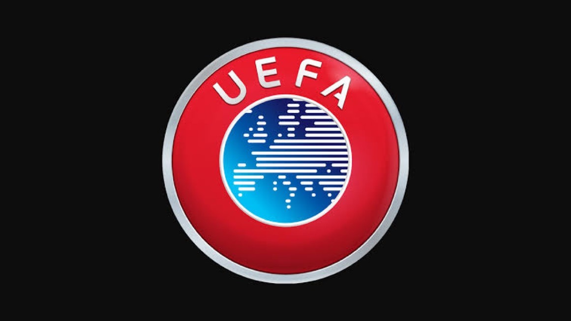UEFA - THEWILL NEWS MEDIA UEFA logo: red circular badge with silver rim and a blue globe in the center.